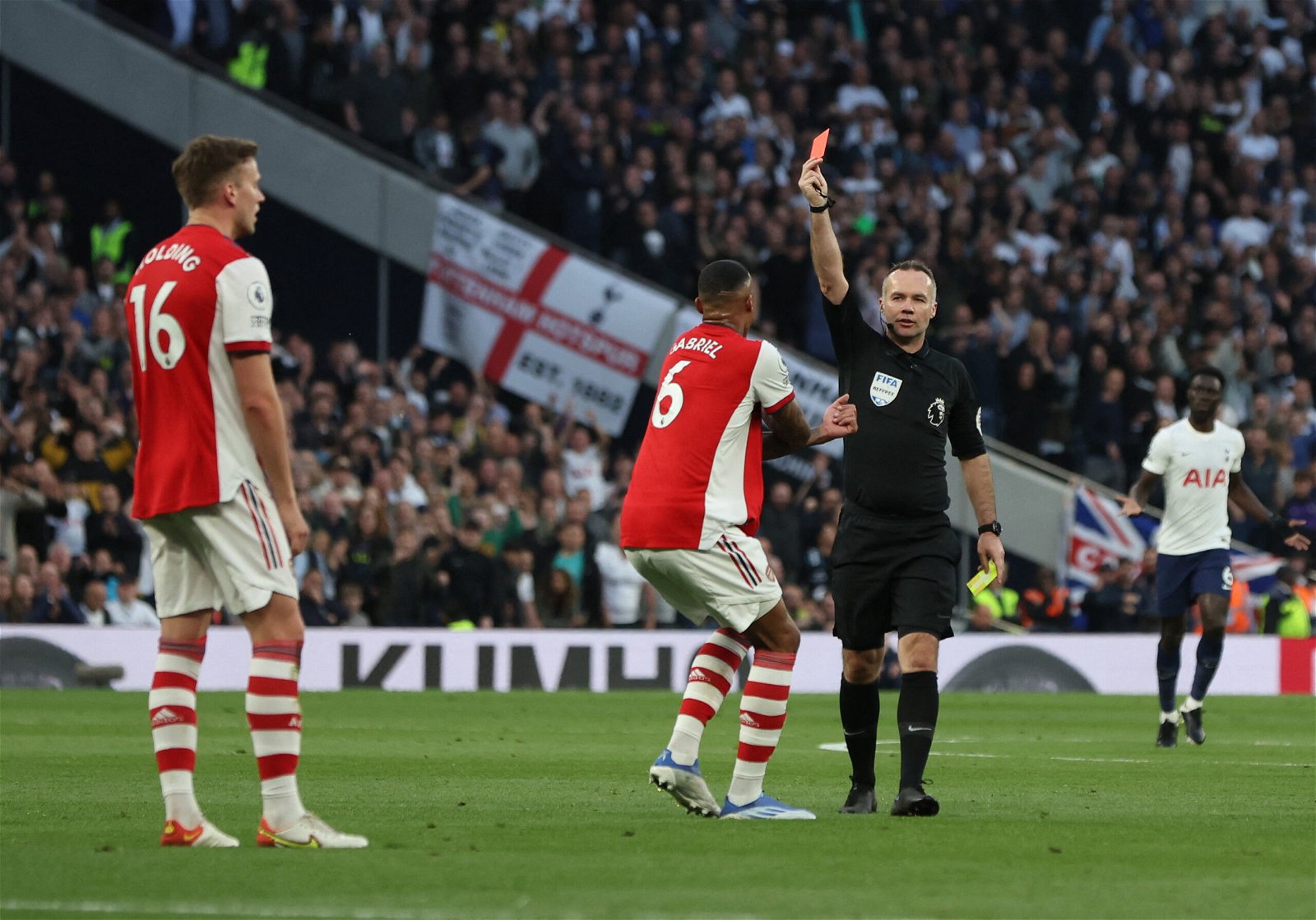 Rob Holding is shown a second yellow card against Tottenham