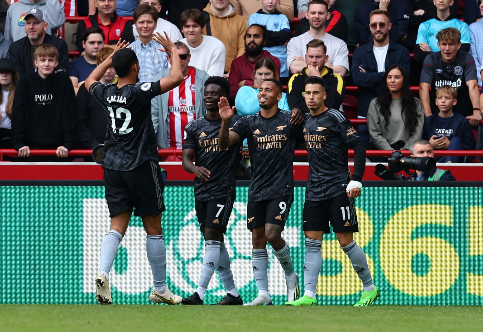 Arsenal players celebrate at Brentford